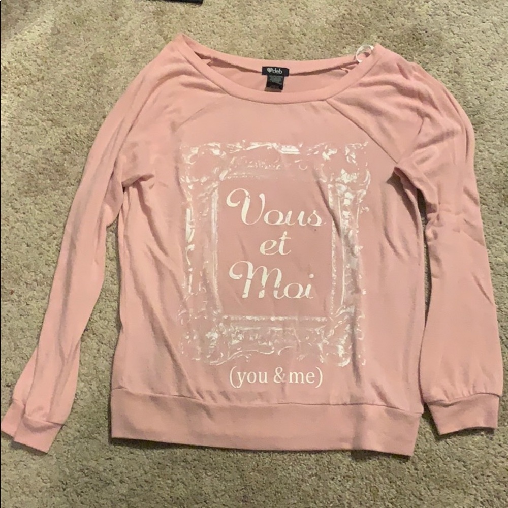 light pink shirt with French writing